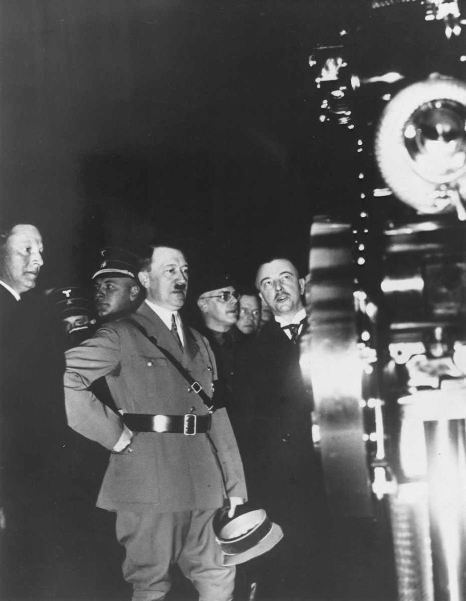 Wilhelm Kissel shows a car to Adolf Hitler at the automobile show